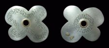 Design of a haiku for a clover-like pendant in silver. Pendant and poem by the client.